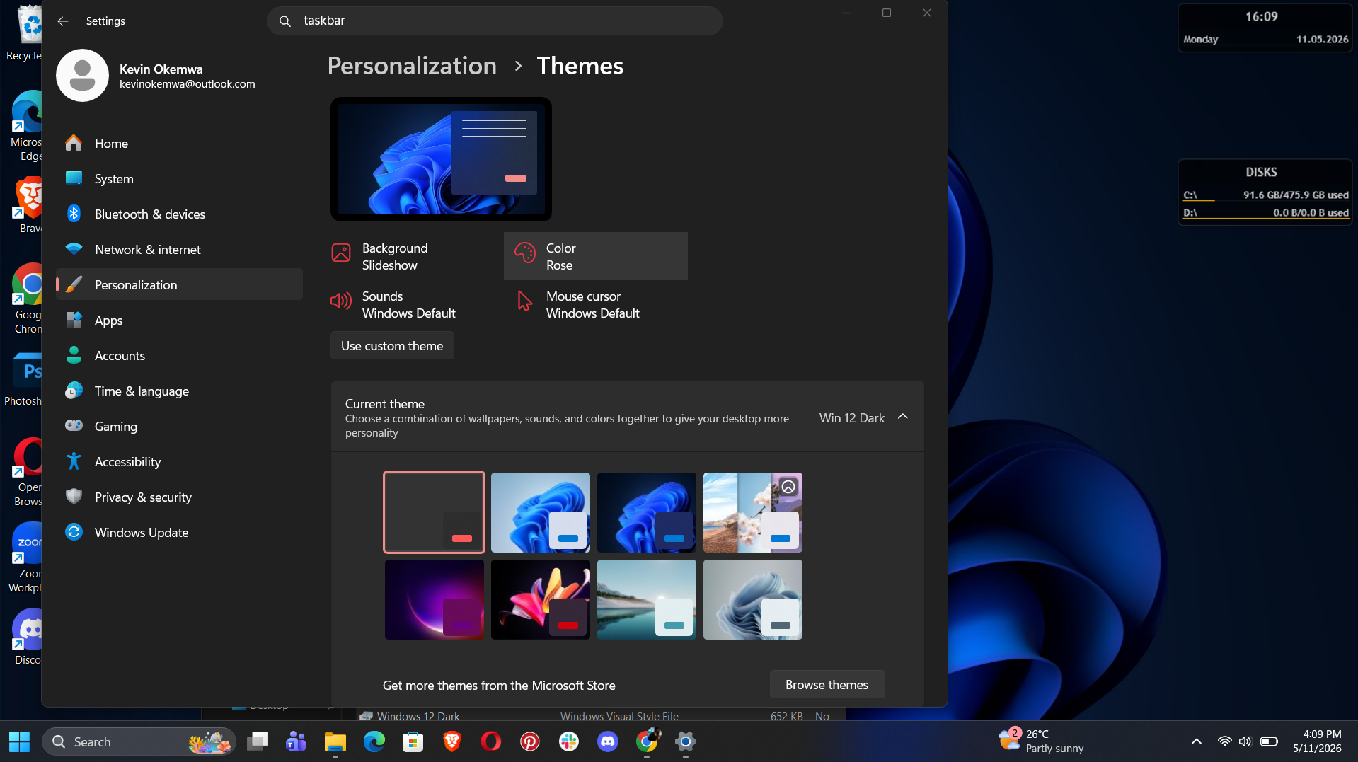 A Windows 11 settings window is open, showing the "Personalization" section focused on "Themes." The current theme is "Win 12 Dark" with a dark background.