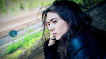 Stock photo of woman staring into the distance 