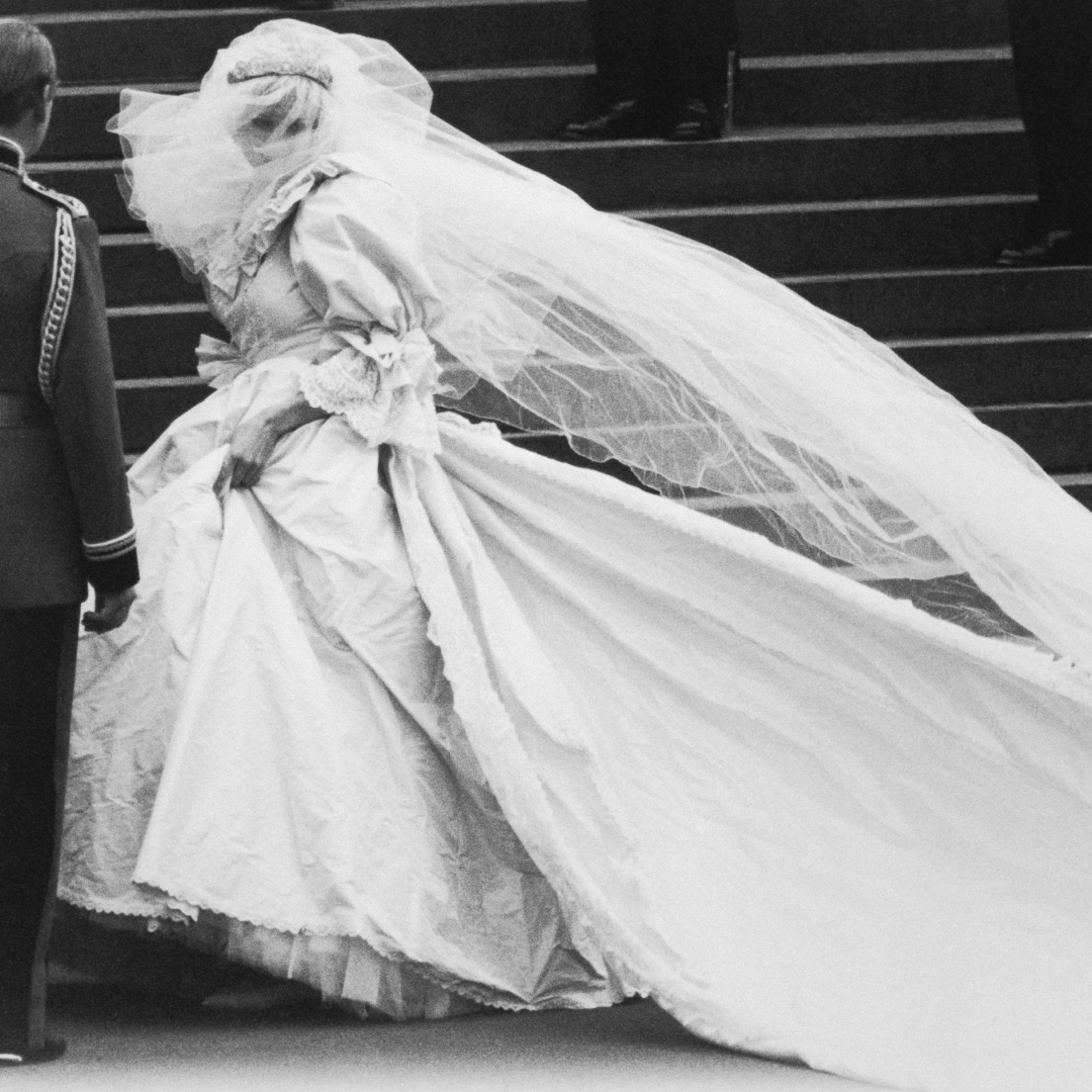Princess Diana walking in her wedding dress and veil