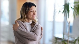 A woman hugging herself