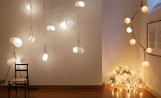 White room with various hanging lights