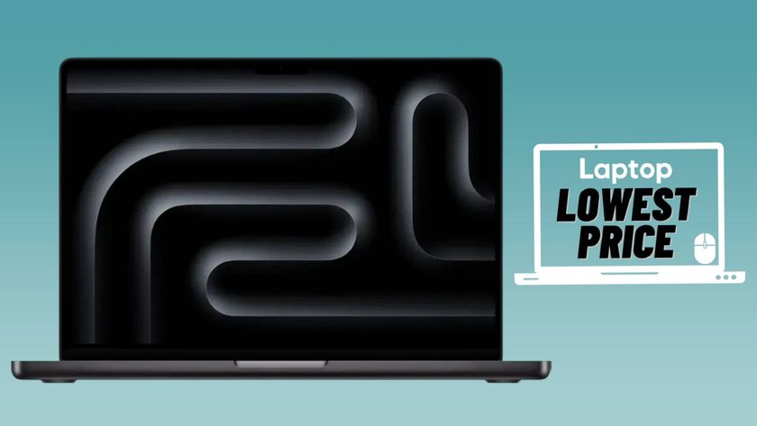 Black M4 MacBook Pro laptop against turquoise gradient background