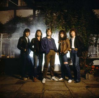 The Ozzy Osbourne band pose outside Ridge Farm Studios in 1983