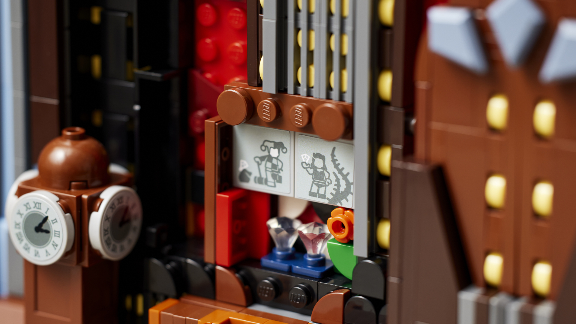 Lego Batman Gotham City set seen close up, with outlines of Harley Quinn and Poison Ivy