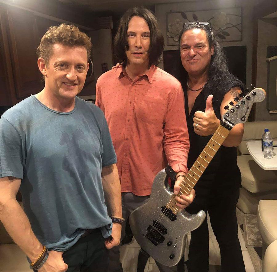 Alex Winter, Keanu Reeves and Andrew Autin pose with custom Charvel San Dimas Pro Mod electric guitar