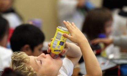 A San Francisco student guzzles the last drop of his chocolate milk during lunch: In Los Angeles, schools are banning all flavored milk to cut back on unnecessary sugar.