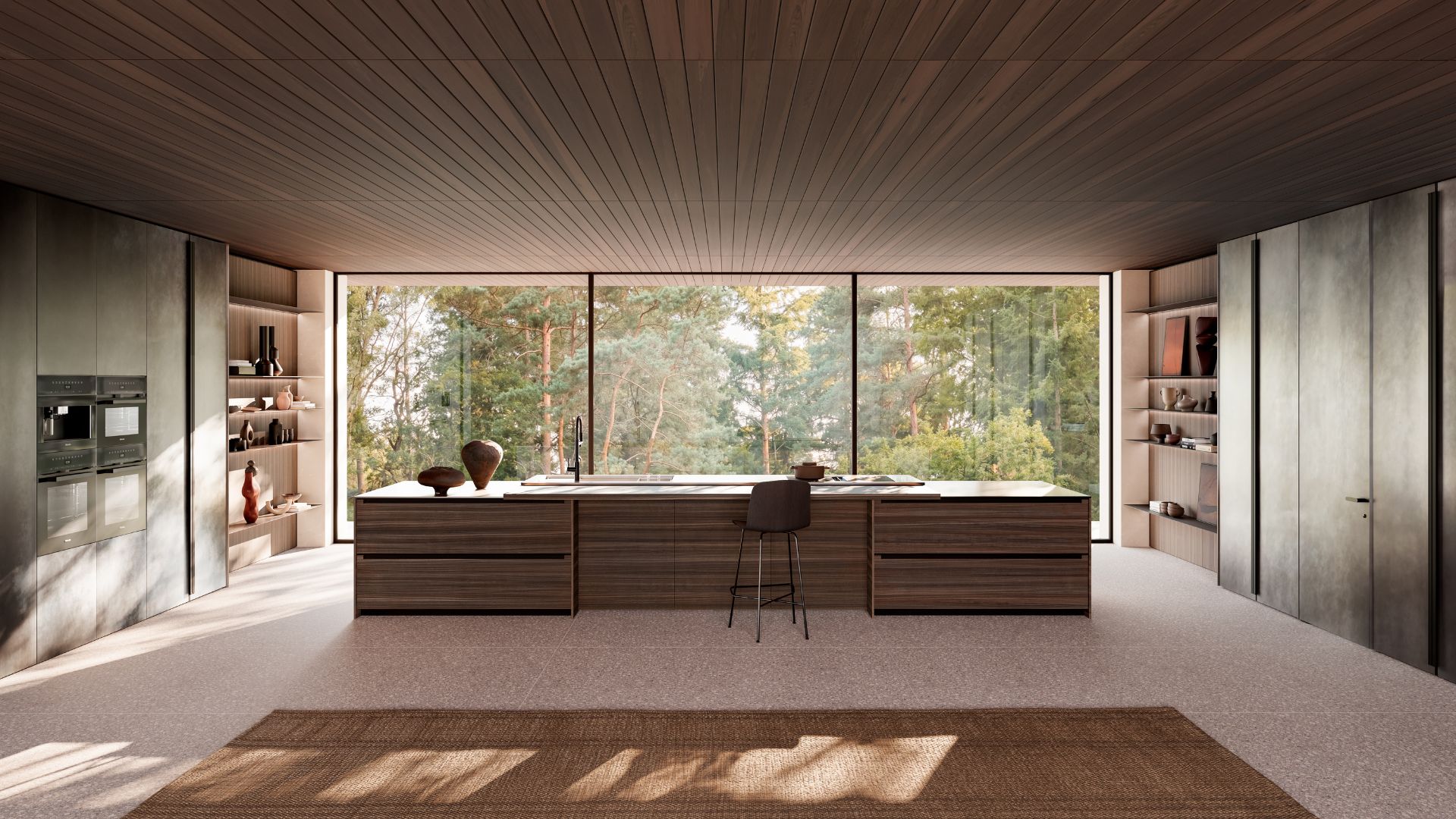 A spacious, bright, open concept kitchen with a long island, and shelving on either side of the room
