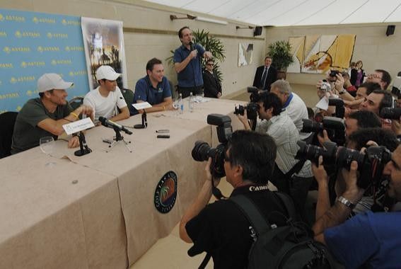 Photographers have Armstrong in focus along with Alberto Contador, Johan Bruyneel and team spokesman Philippe Maertens.