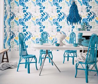 blue chairs round a white dining table