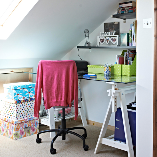 home office with white wall and glass desk and chair