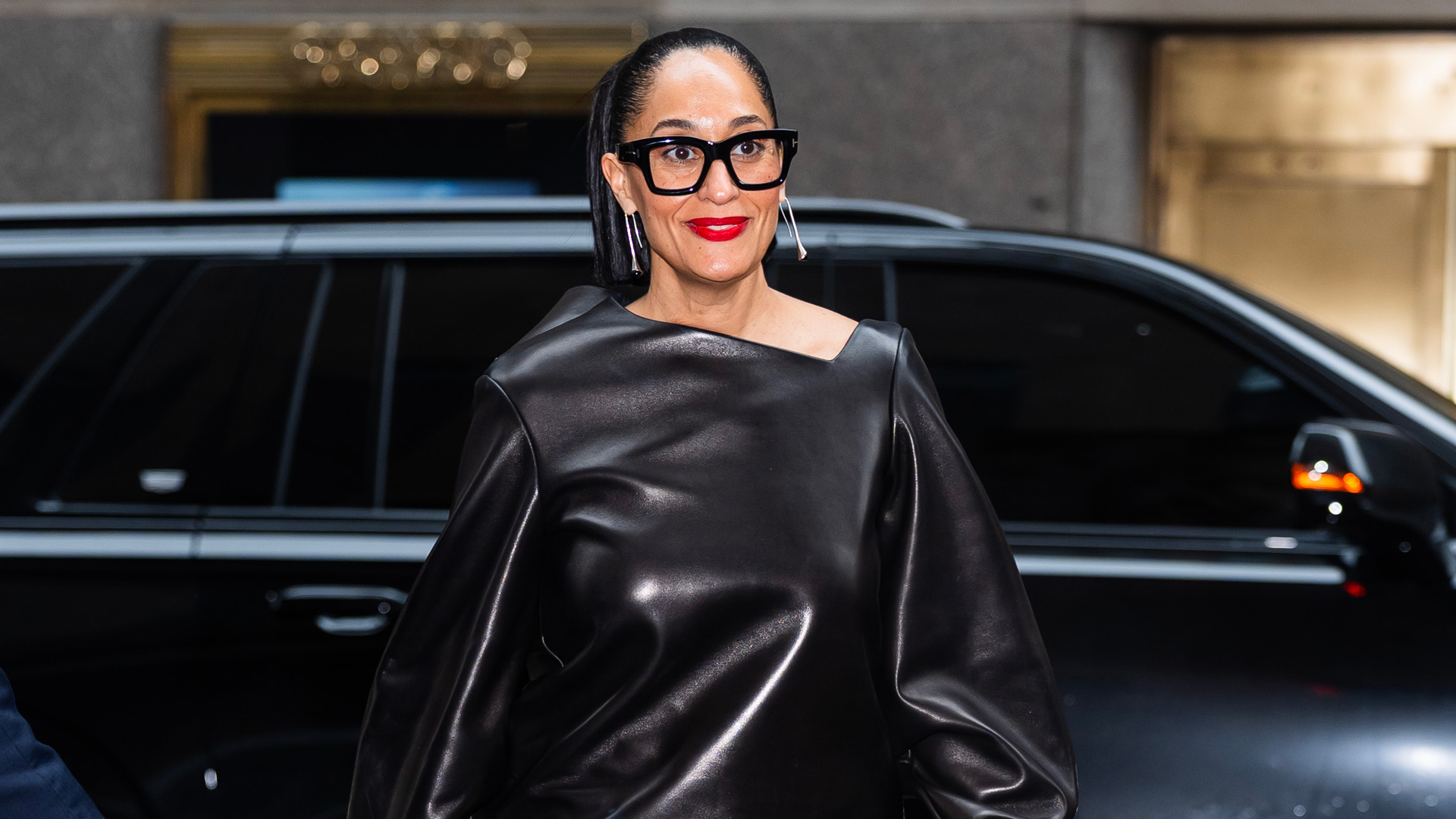 Tracee Ellis Ross in a red lip and oversized glasses