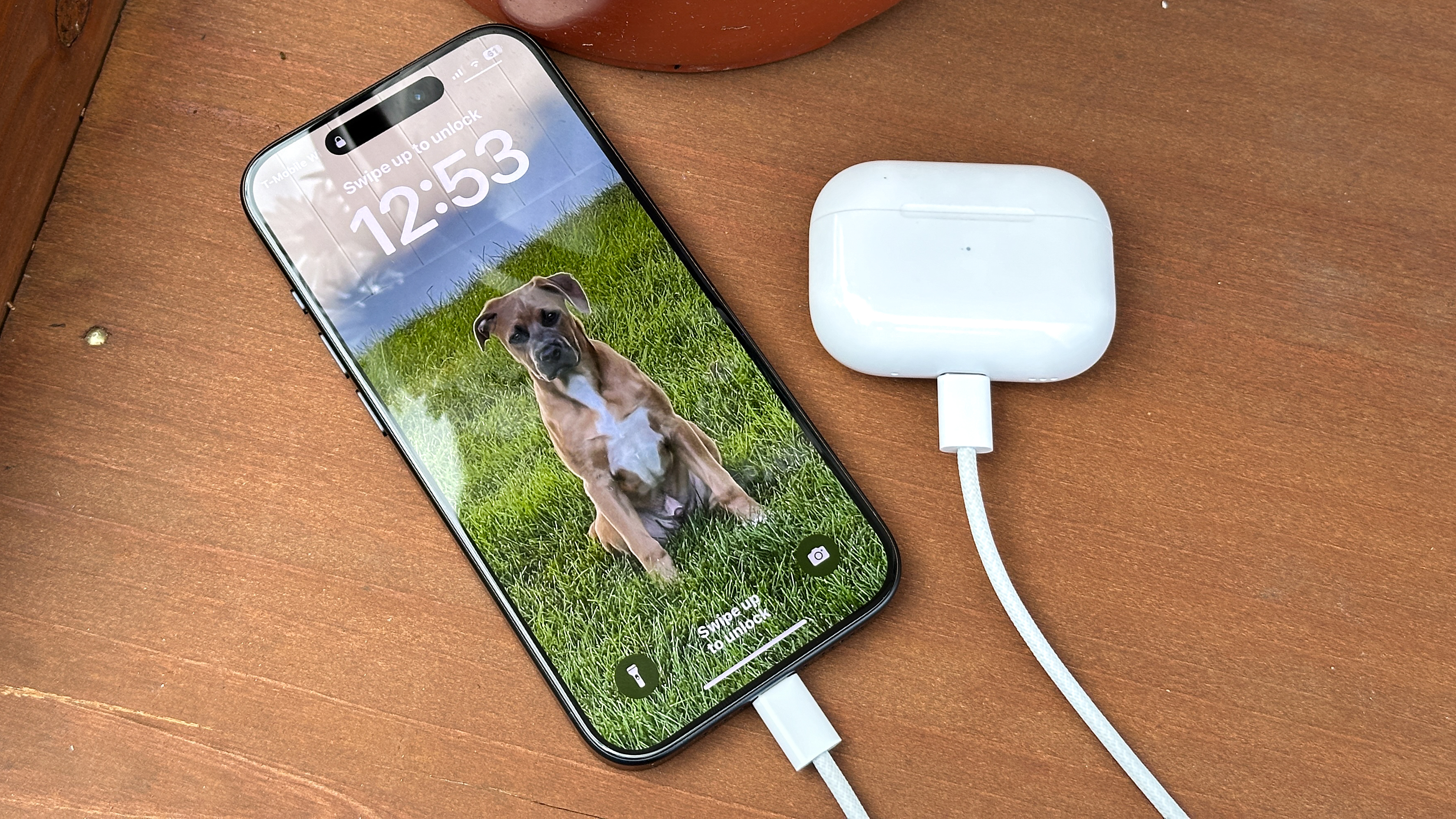 iPhone 15 Pro charging AirPods.