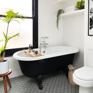 bathroom with pattern tiles and bathtub