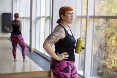Woman at the gym, hoping to beat the weight-loss plateau