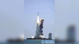 A Chinese Long March 11 rocket launches five small satellites into orbit from an ocean platform in the East China Sea on April 29, 2022. 