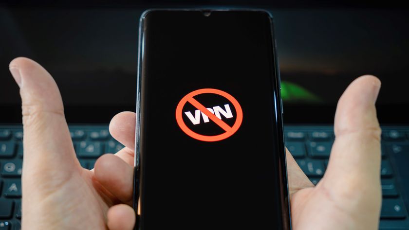 Icon of blocked VPN on a black smartphone screen on a man hands. Blocking VPN services concept 