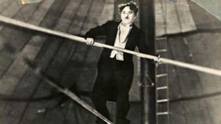 Charlie Chaplin on a tighrope.