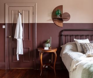bedroom with two tone pink and deep purple wall and door
