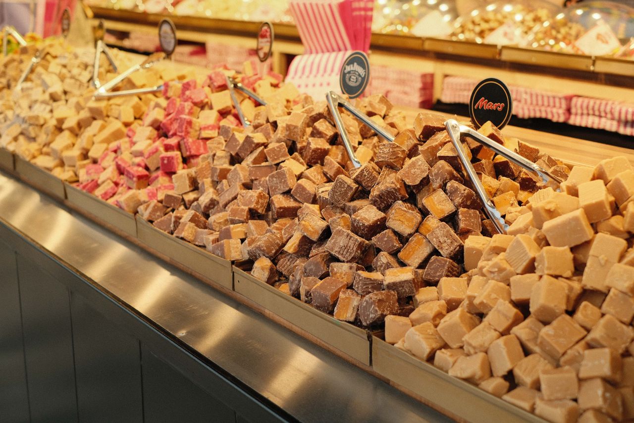 Sweet shop selling different kinds of fudge all stacked up