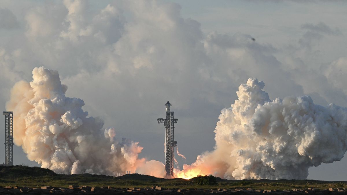 large rocket lifts off from launch pad.