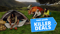 Campers in a grass field with tents and Killer Deals 