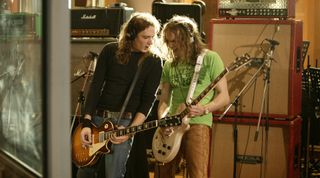 Brothers Dan and Justin Hawkins of English cod-metal band The Darkness recording guitar parts for the Band Aid 20 charity single, 'Do They Know It's Christmas', at Air Studios, London, November 2004.