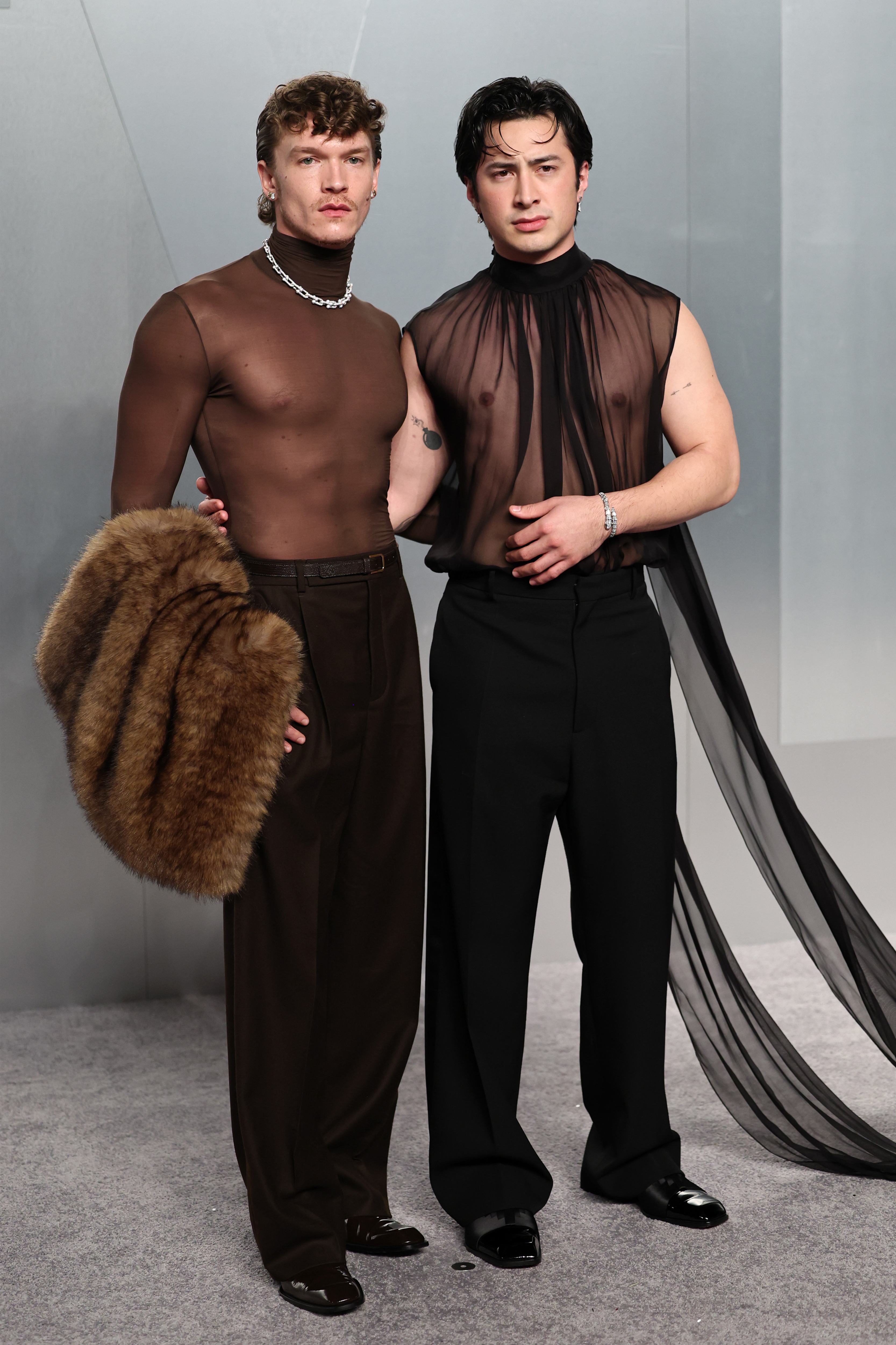Connor Storrie and Hudson Williams wearing 2026 Vanity Fair Oscars after-party outfits.