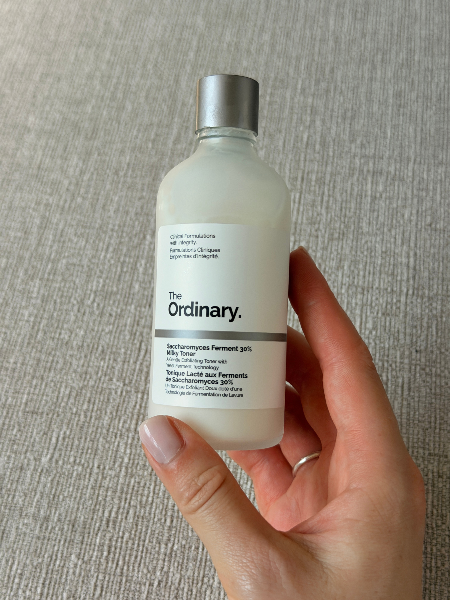 Grace holding The Ordinary Saccharomyces Ferment Milky Toner