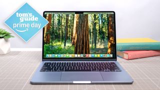 MacBook Air M4 on table with Tom's Guide Prime Day badge