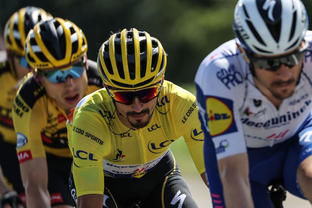 Team Deceuninck rider Frances Julian Alaphilippe C wearing the overall leaders yellow jersey rides in the pack during the 4th stage of the 107th edition of the Tour de France cycling race 157 km between Sisteron and OrcieresMerlette on September 1 2020 Photo by KENZO TRIBOUILLARD AFP Photo by KENZO TRIBOUILLARDAFP via Getty Images