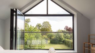 modern Juliet balcony in bedroom with bifold doors