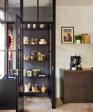 Kitchen with view to pantry with glass surround and open shelves