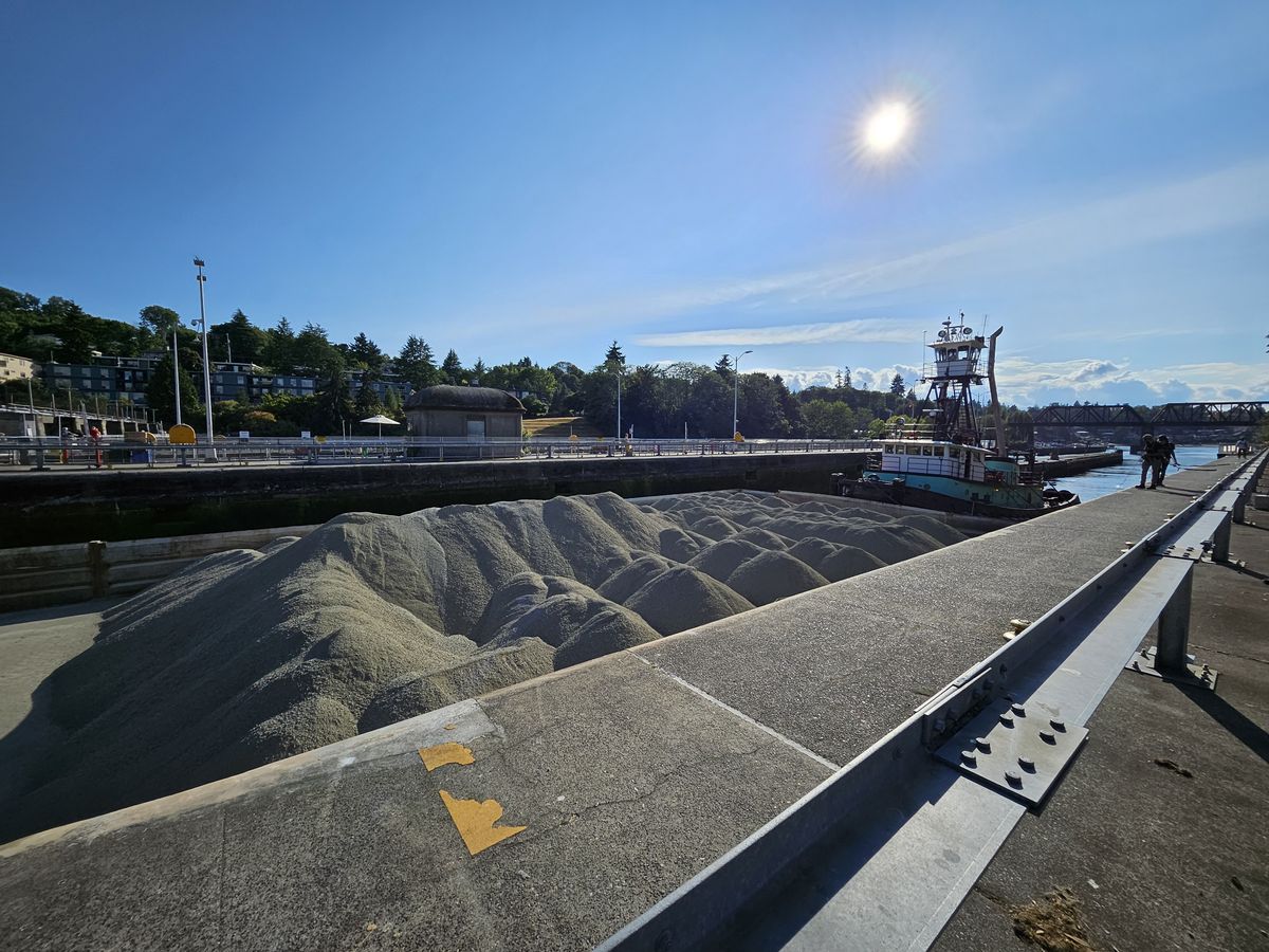 A boat moving mounds of dirt