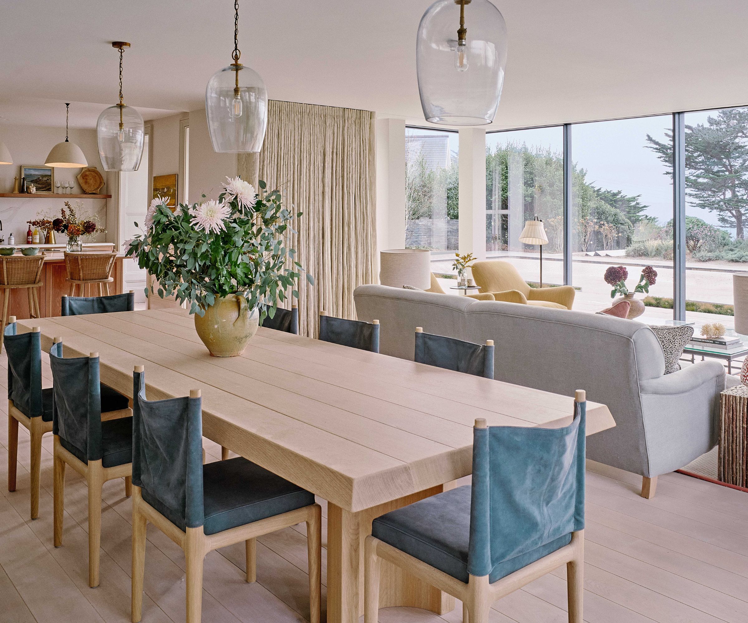 Open plan kitchen diner and living room with large windows