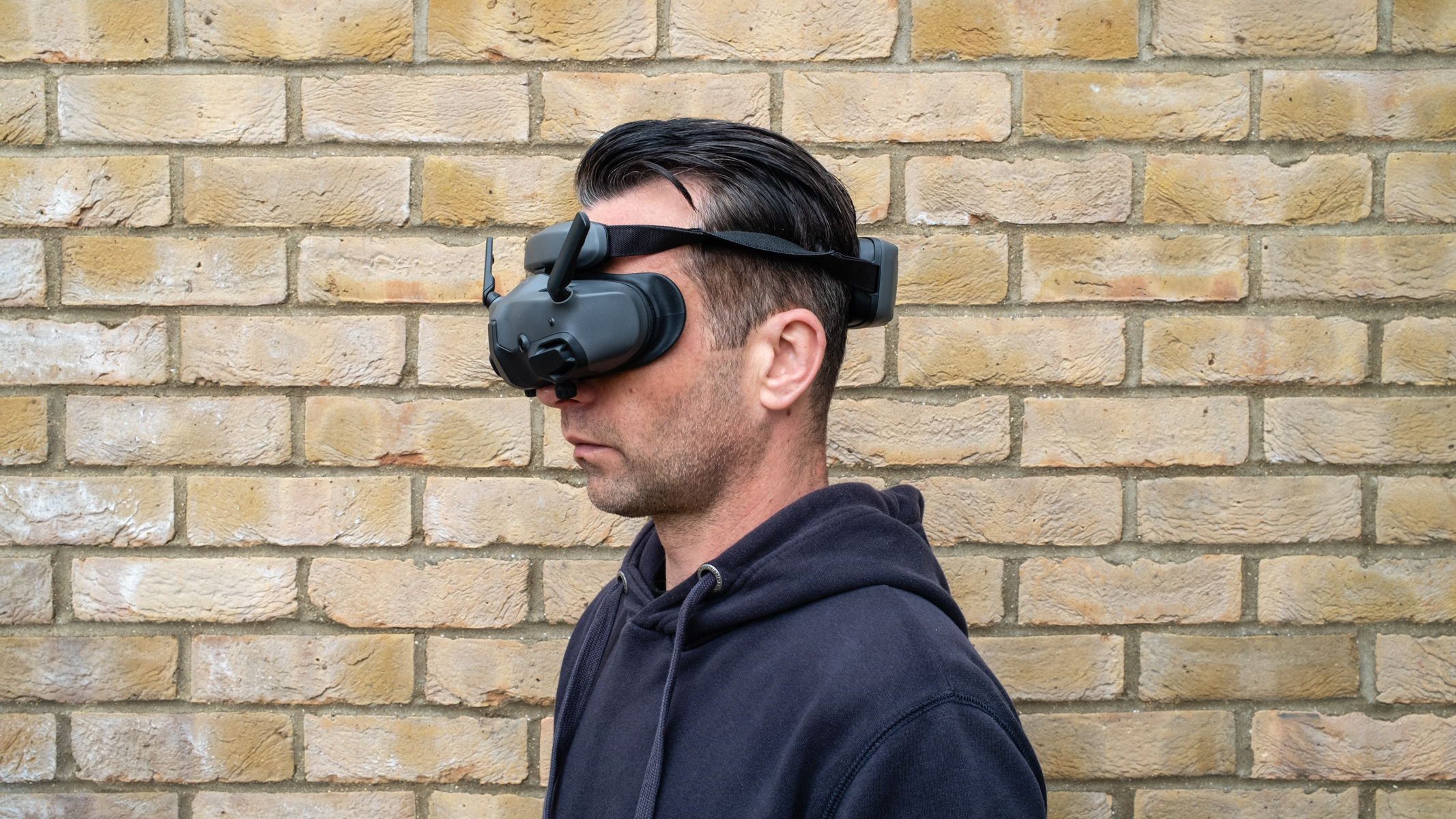 A man wearing DJI Goggles N3 FPV Goggles