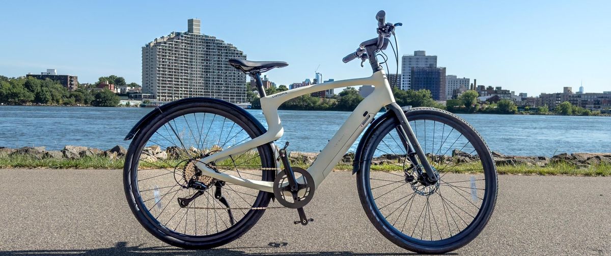 Urtopia Carbon 1 Pro electric bike by a lake in the sunshine