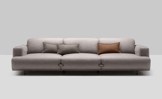 Three seat upholstered grey sofa.
