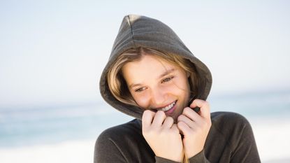 M&S reveal: Pretty blonde woman relaxing in hoodie