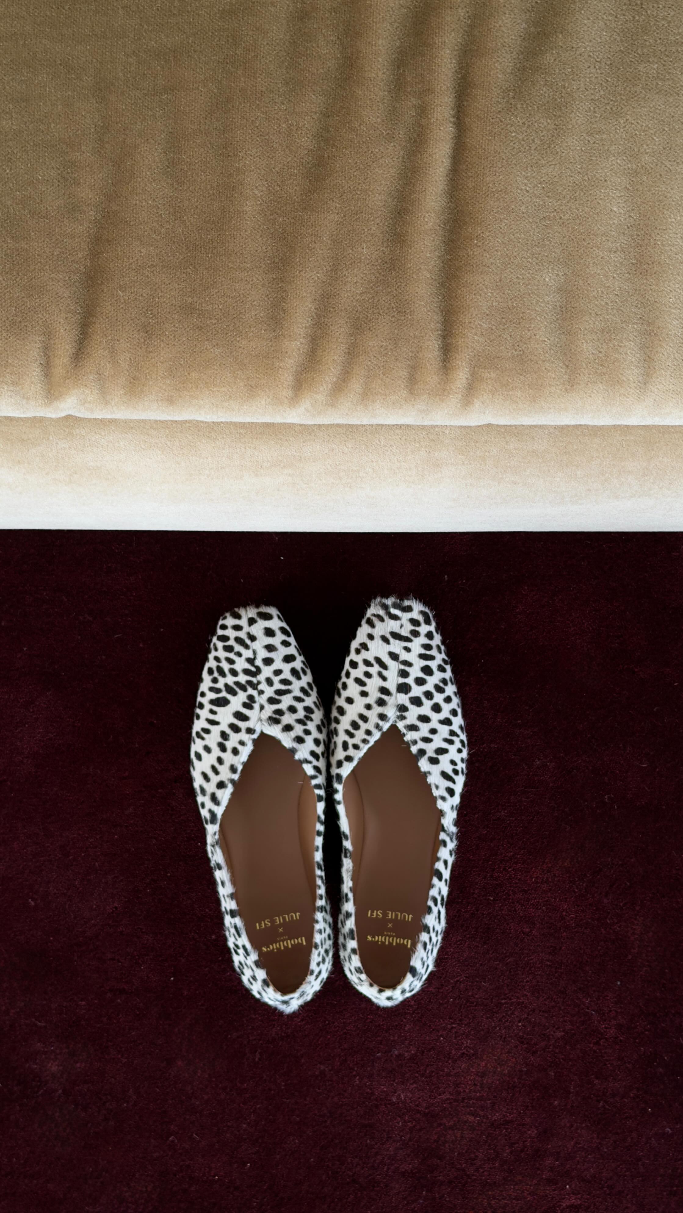 An image of @juliesfi wearing square-toe Dalmatian spot ballet flats, one of the biggest shoe trends of summer 2026.