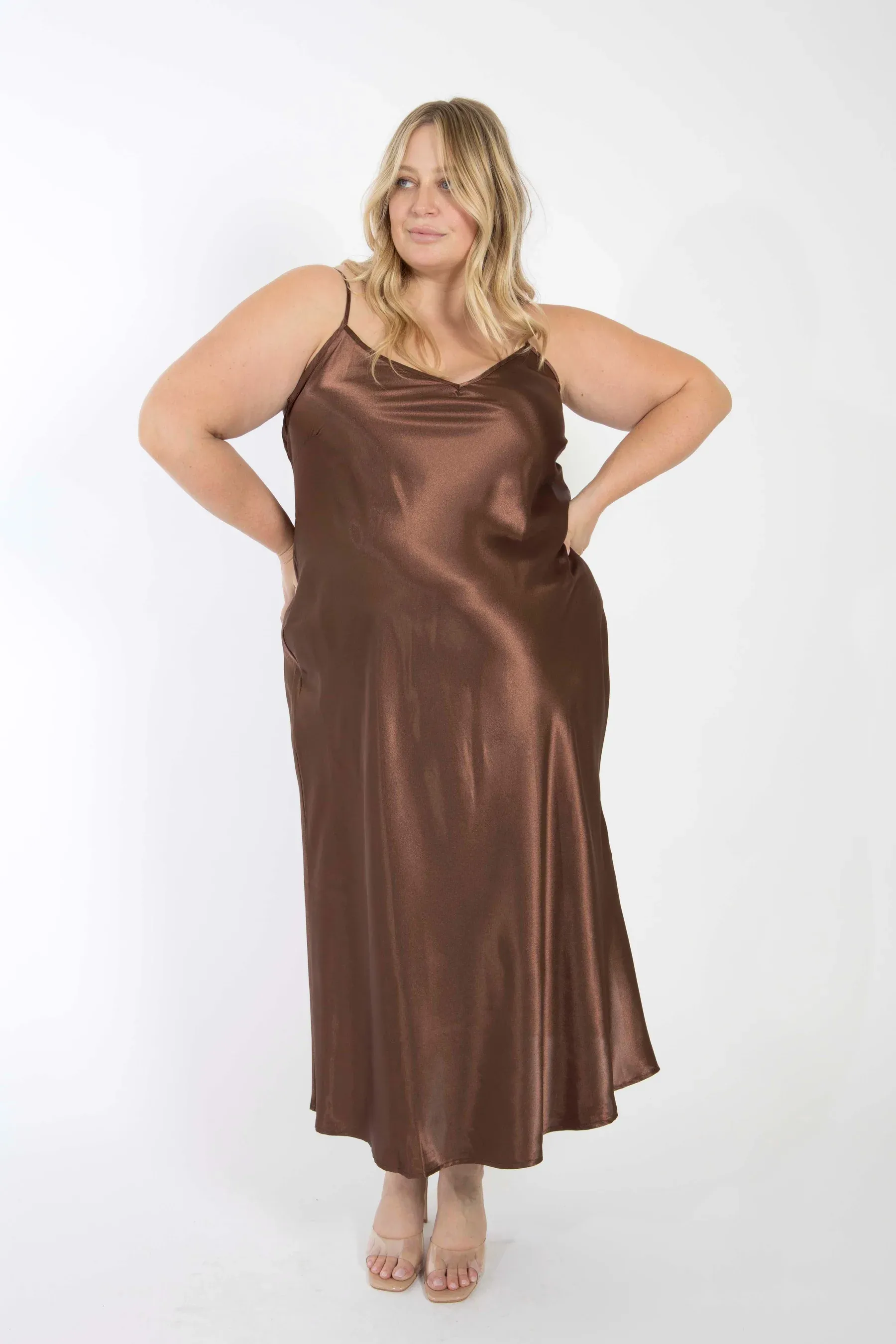 Model wears chocolate brown slip dress