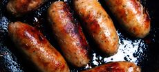 Brilliant British sausages cooking in a frying pan