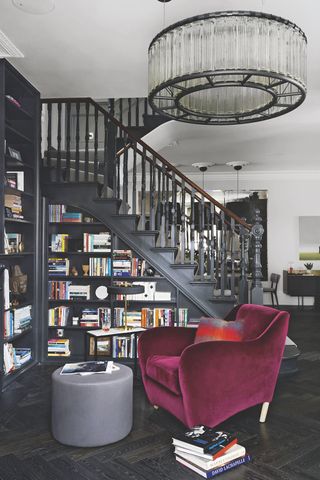 black staircase with build in bookshelf