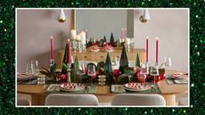west elm christmas decor featuring a festive christmas tablescape with candles red plates and gold accents