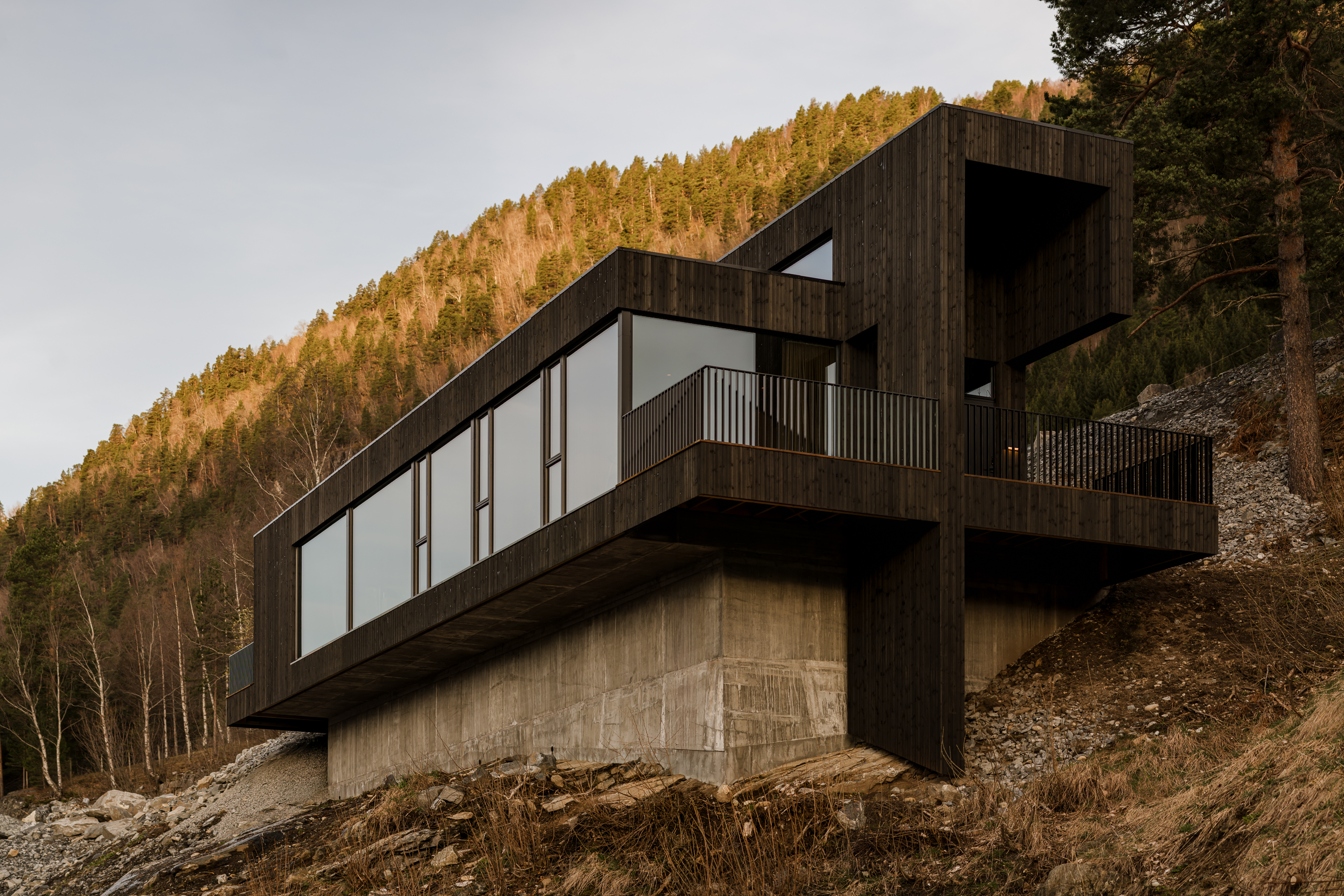 A long run of fjord-facing windows makes up the main facade