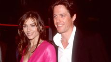 370137 01: FILE PHOTO: Elizabeth Hurley and Hugh Grant attend the premiere of "Mickey Blue Eyes" August 17, 2000 in Westwood, CA. The couple of 13 years have decided to call it quits May 23, 