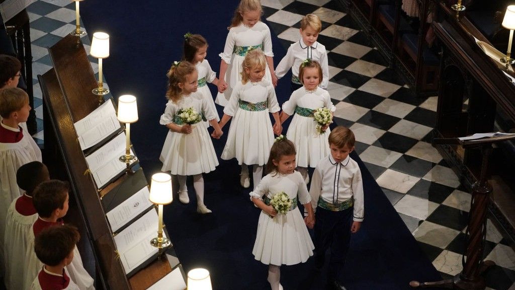 Bridesmaids and page boys Princess Charlotte of Cambridge, Savannah Phillips, Prince George of Cambridge, Maud Windsor, Isla Phillips, Mia Tindall, Theodora Williams and Louis de Givency walk up the aisle after the wedding of Jack Brooksbank and Princess Eugenie of York at St. George&#039;s Chapel on October 12, 2018 in Windsor, England