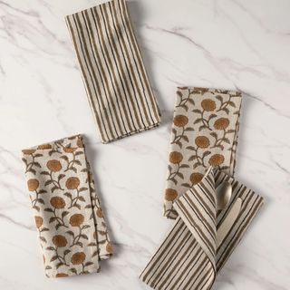 striped and floral patterned napkins in neutral colors