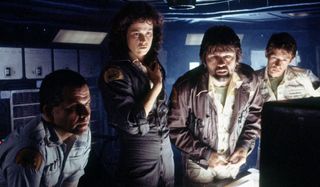 Alien Sigourney Weaver and her crewmates reading a report on screen