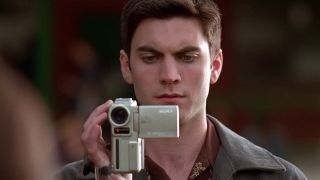 Ricky films with his camera in American Beauty.