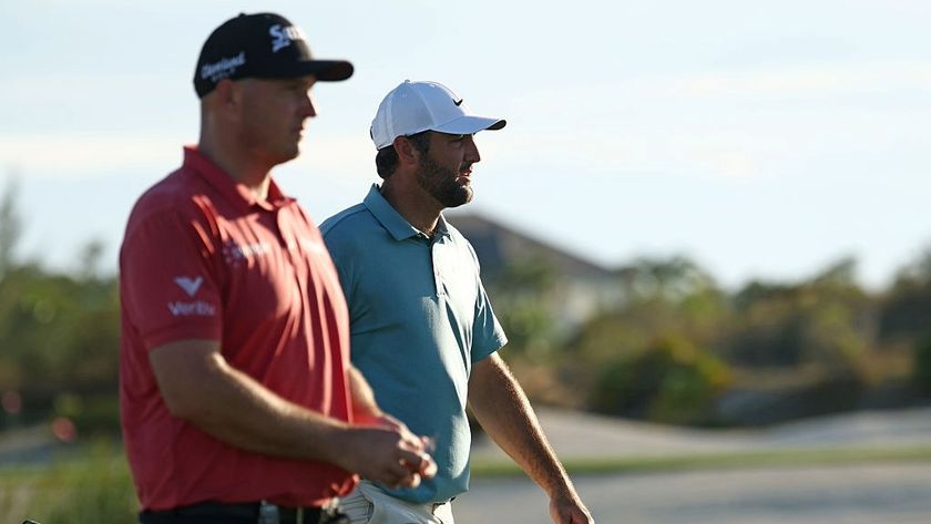 Sepp Straka, in a red shirt, and Scottie Scheffler, in a teal shirt, walk together during their excellent third rounds at the Hero World Challenge 2025 golf tournament in the Bahamas